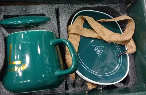 Ceramic Coffee Cup with Automatic Heating Pad | only in green color.